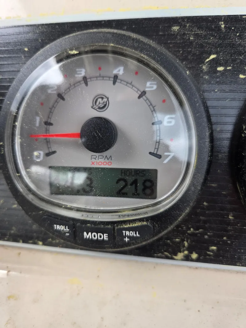 Slide: The Image of Close-up of a 2019 Boston Whaler 240 Dauntless RPM gauge showing 218 hours. - 6