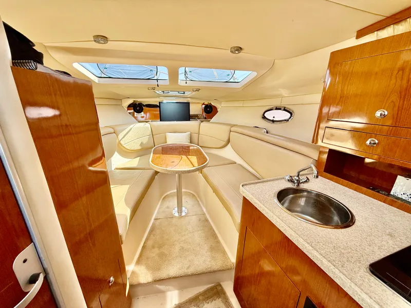 Slide: The Image of Luxurious interior of 2007 Regal 2860 Window Express yacht with seating and kitchenette. - 11