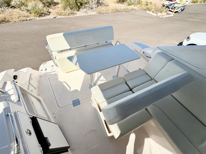 Slide: The Image of 2007 Regal 2860 Window Express boat interior with seating and table setup. - 21