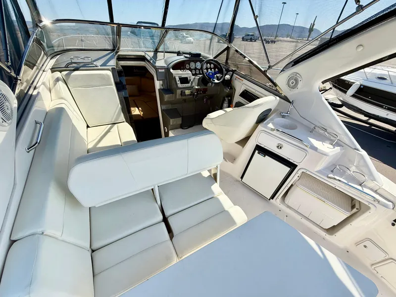 Slide: The Image of 2007 Regal 2860 Window Express boat interior with white seating and control panel. - 22