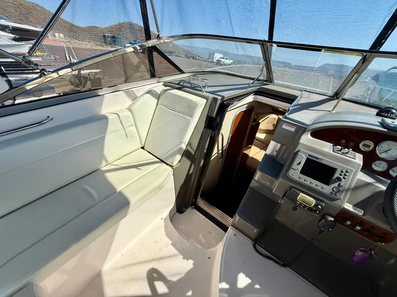 Slide: The Image of 2007 Regal 2860 Window Express boat interior with helm and seating area. - 25