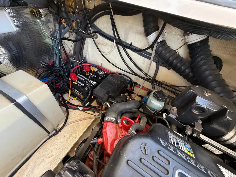 Slide: The Image of Engine compartment of a 2007 Regal 2860 Window Express boat, showing wiring and components. - 37