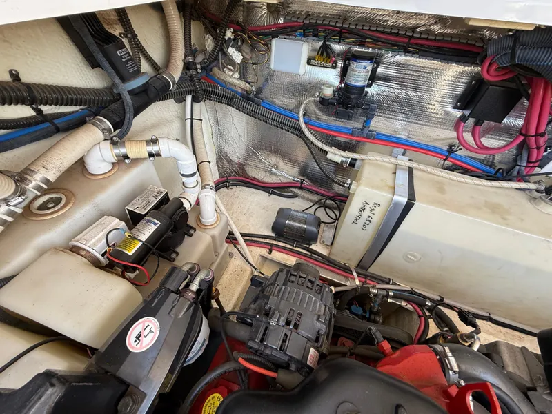 Slide: The Image of Engine compartment of a 2007 Regal 2860 Window Express boat, showing wiring and components. - 38