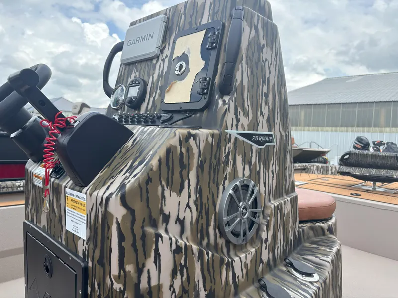 Slide: The Image of 2025 Avid 20CC Rogue boat console with camouflage design and Garmin equipment. - 13