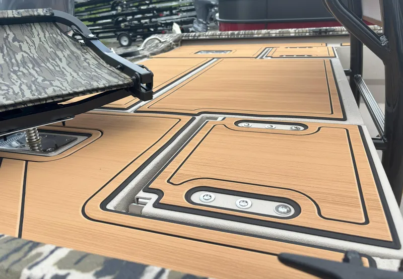 Slide: The Image of 2025 Avid 20CC Rogue boat deck with sleek, modern design and camo accents. - 5