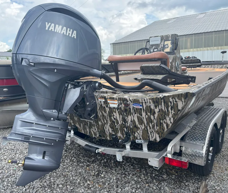Slide: The Image of Avid 20CC Rogue 2025 boat with Yamaha outboard motor, camo design, on a trailer. - 8