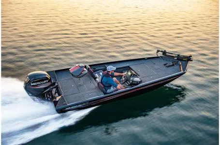 Slide: The Image of 2022 Ranger RT178 boat speeding on water at sunset. - 2