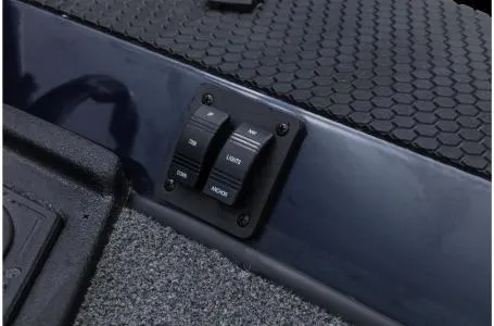 Slide: The Image of 2022 Ranger RT178 boat control panel with switches on textured surface. - 34