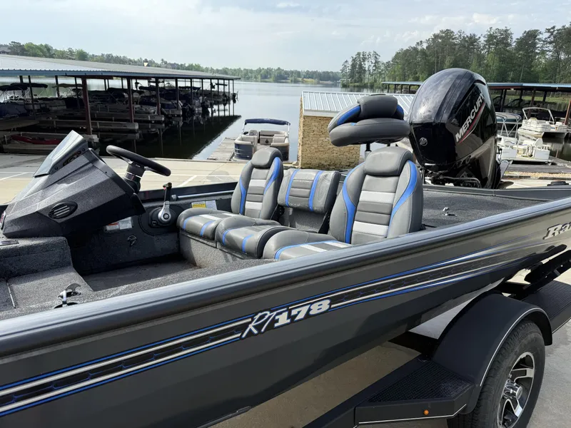 Slide: The Image of 2022 Ranger RT178 boat with Mercury engine docked by a serene lake. - 40