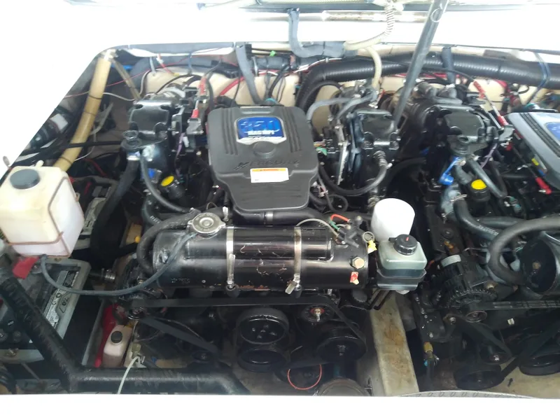 Slide: The Image of Engine compartment of a 2008 Formula 310 Sun Sport boat, showcasing dual engines. - 48