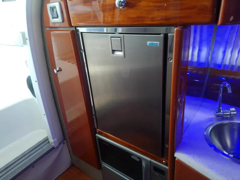 Slide: The Image of 2008 Formula 310 Sun Sport yacht interior with stainless steel fridge and sink. - 35