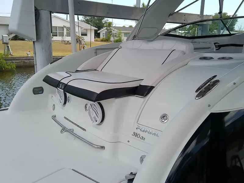 Slide: The Image of 2008 Formula 310 Sun Sport boat with sleek white seating and modern design. - 9