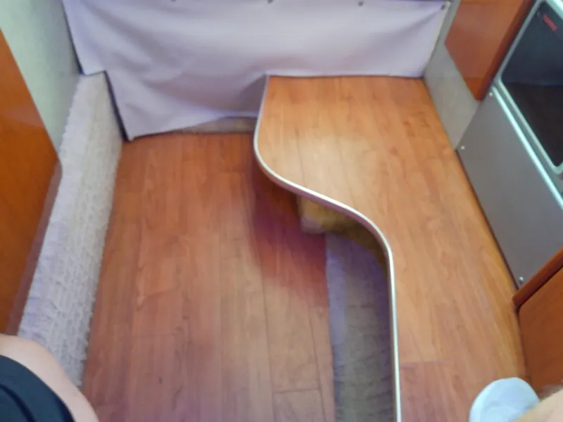 Slide: The Image of Interior of 2008 Formula 310 Sun Sport with wooden flooring and curved seating area. - 34