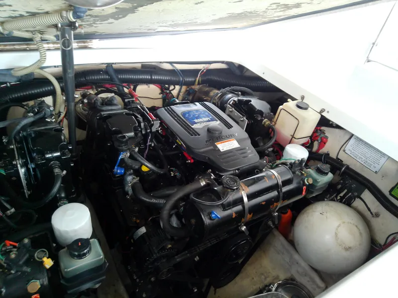 Slide: The Image of Engine compartment of a 2008 Formula 310 Sun Sport boat, showcasing dual engines and components. - 47