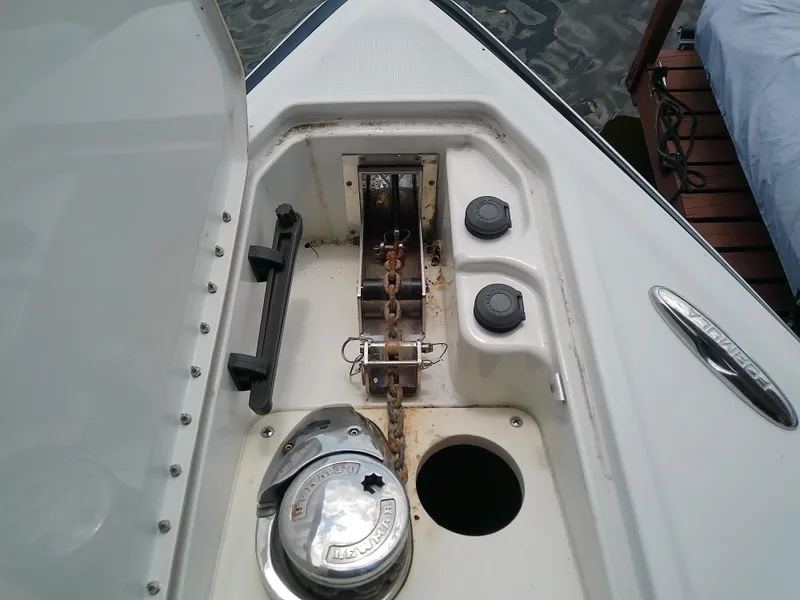 Slide: The Image of 2008 Formula 310 Sun Sport anchor compartment with chain and winch system. - 26