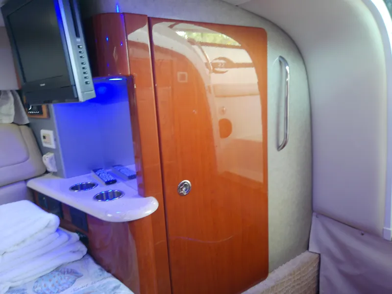Slide: The Image of 2008 Formula 310 Sun Sport cabin interior with wood cabinetry and modern amenities. - 42