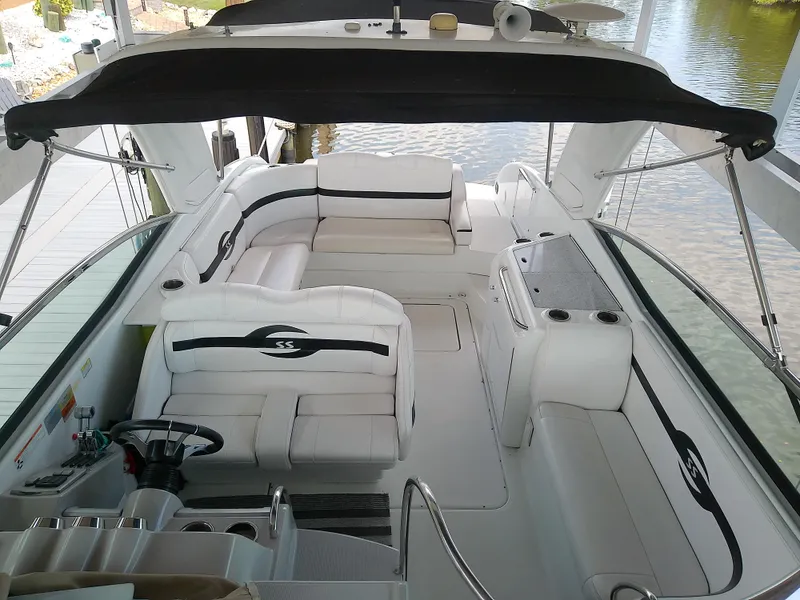 Slide: The Image of 2008 Formula 310 Sun Sport boat interior with white seating and black accents. - 27