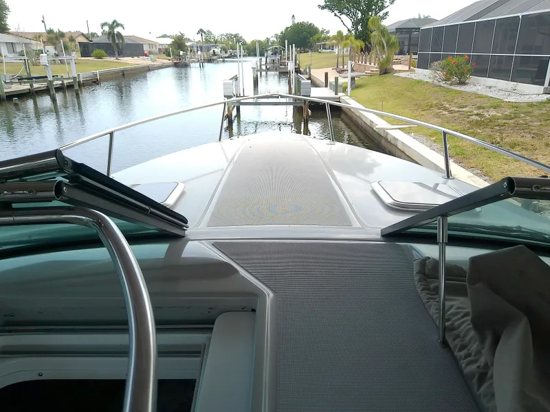 Slide: The Image of 2008 Formula 310 Sun Sport boat docked in a scenic canal setting. - 29