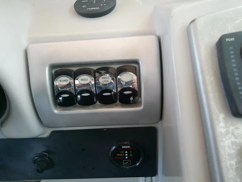 Slide: The Image of Control panel of a 2008 Formula 310 Sun Sport boat with labeled switches. - 21