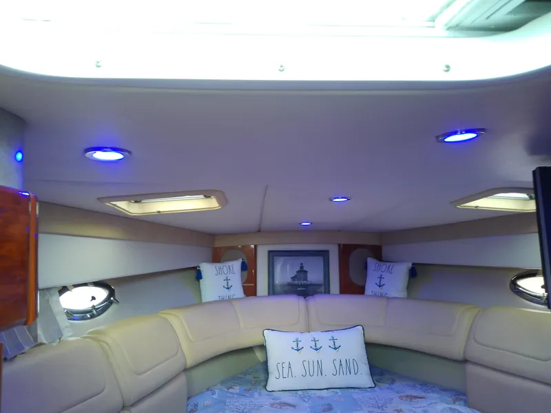 Slide: The Image of Interior of a 2008 Formula 310 Sun Sport boat with cozy seating and nautical decor. - 32