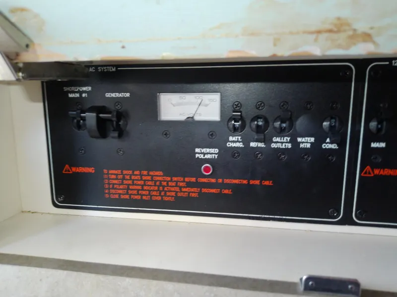 Slide: The Image of Control panel of a 2008 Formula 310 Sun Sport boat, featuring various switches and warnings. - 45