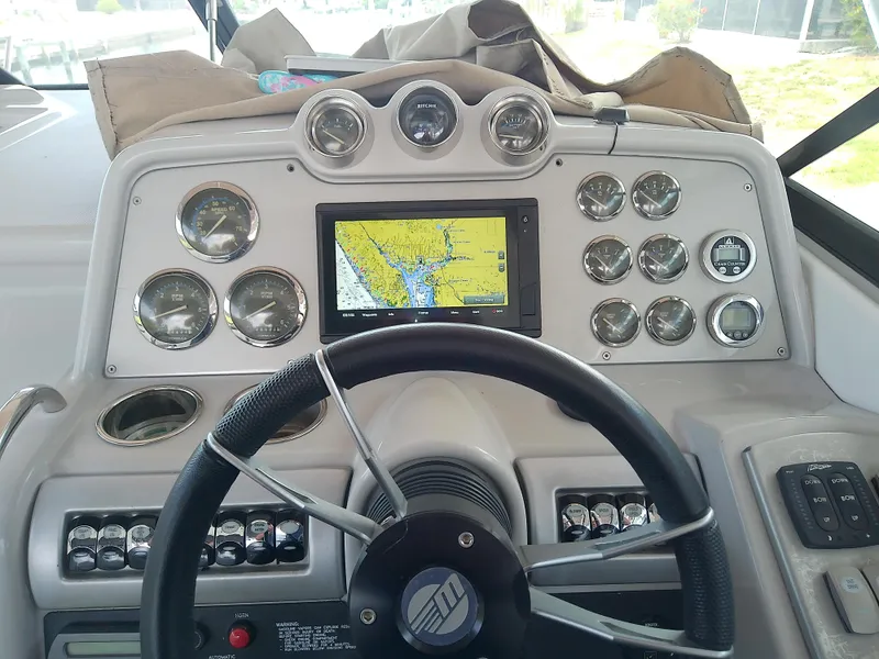 Slide: The Image of Dashboard of a 2008 Formula 310 Sun Sport boat with navigation system and gauges. - 19