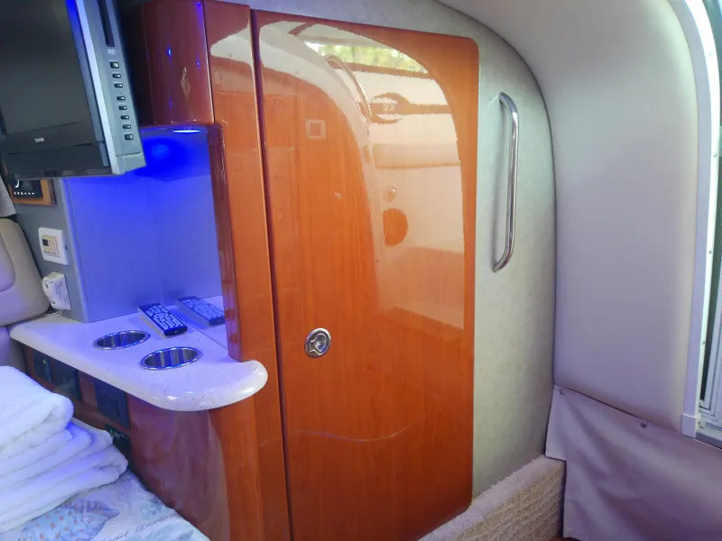 Slide: The Image of Interior of a 2008 Formula 310 Sun Sport boat with wood finish and modern amenities. - 43