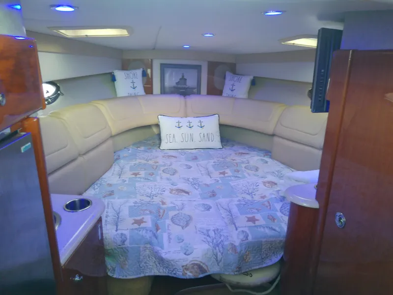 Slide: The Image of 2008 Formula 310 Sun Sport cabin with cozy bed and nautical decor. - 31