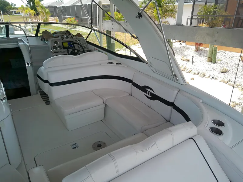 Slide: The Image of 2008 Formula 310 Sun Sport boat interior with white seating and control panel. - 11