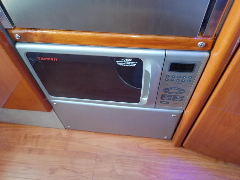 Slide: The Image of Built-in microwave in 2008 Formula 310 Sun Sport boat interior. - 37
