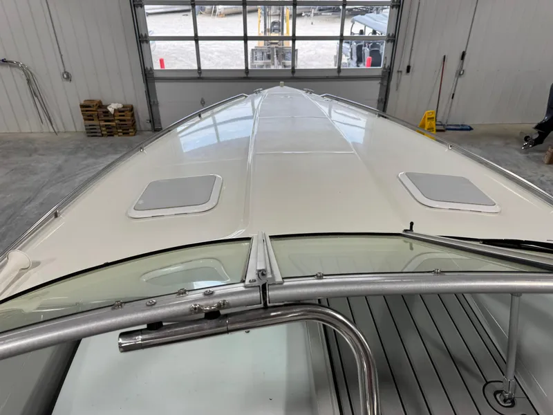 Slide: The Image of 1998 Formula 330 SS boat in a garage, viewed from the bow. - 8