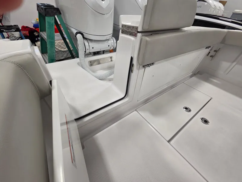 Slide: The Image of 2023 Jupiter 30 boat interior with white seating and deck, showcasing modern design. - 11