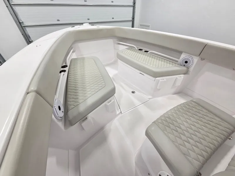 Slide: The Image of 2023 Jupiter 30 boat interior with cushioned seating and modern design. - 14
