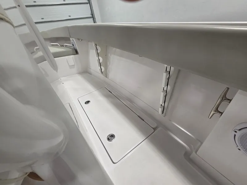 Slide: The Image of 2023 Jupiter 30 boat interior with storage compartments and sleek design. - 15