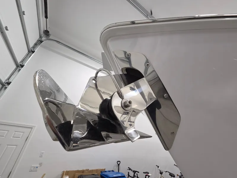 Slide: The Image of Stainless steel anchor on 2023 Jupiter 30 boat in a garage setting. - 3