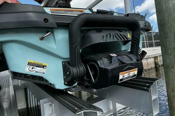 Slide: The Image of 2022 Sea-Doo Wake Pro 230 jet ski on a dock, showcasing rear design and features. - 15