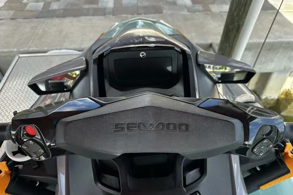 Slide: The Image of 2022 Sea-Doo Wake Pro 230 dashboard and handlebars, showcasing controls and design. - 4