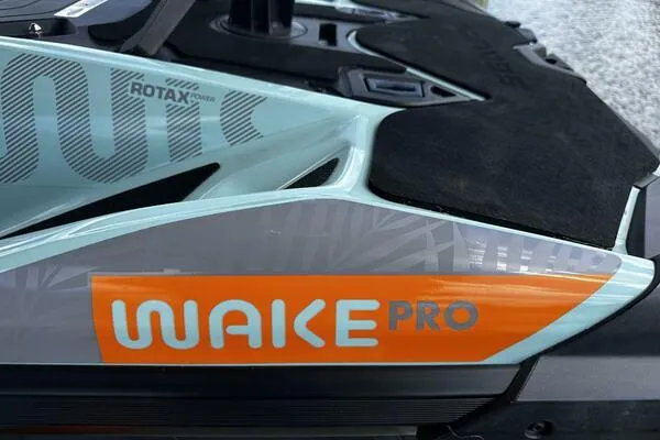 Slide: The Image of 2022 Sea-Doo Wake Pro 230 close-up, showcasing branding and design details. - 5