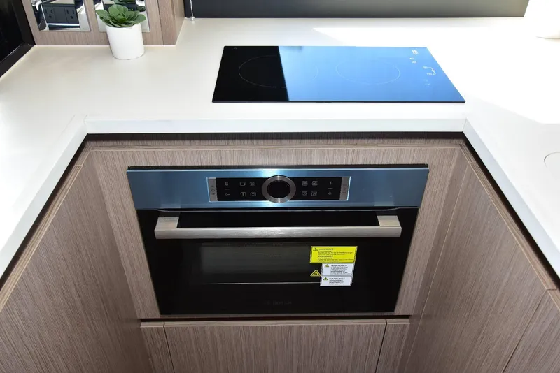 Slide: The Image of Modern kitchen in 2022 Sealine C430 yacht with sleek oven and cooktop. - 49
