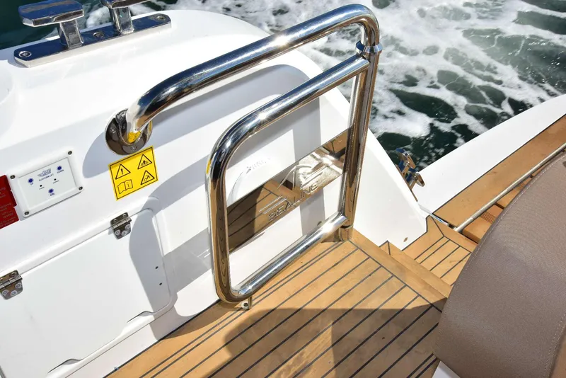 Slide: The Image of 2022 Sealine C430 yacht deck with stainless steel railing and teak flooring. - 39