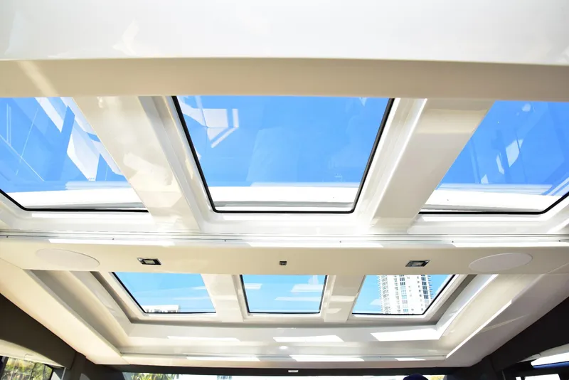 Slide: The Image of Skylight view from 2022 Sealine C430 yacht, showcasing modern design and bright interior. - 42