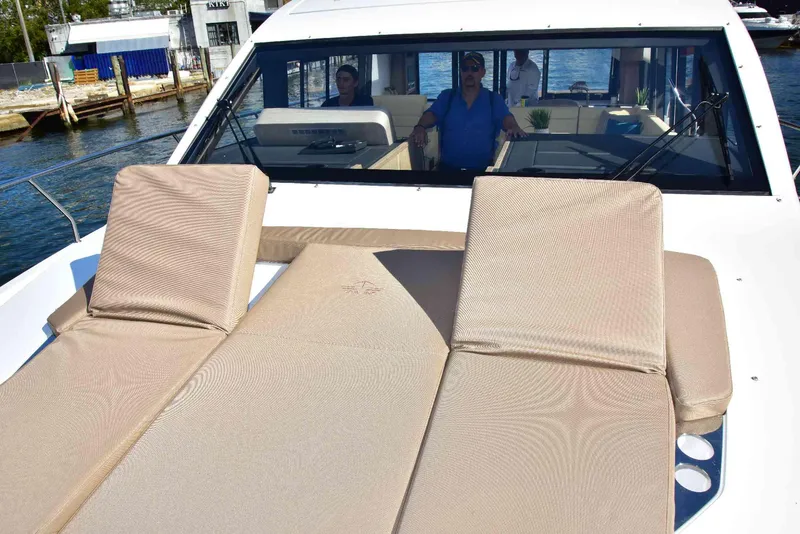 Slide: The Image of 2022 Sealine C430 yacht with sun loungers on deck, docked at marina. - 45