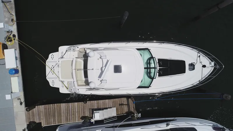 Slide: The Image of Overhead view of 2013 Sea Ray 410 Sundancer docked at marina. - 11