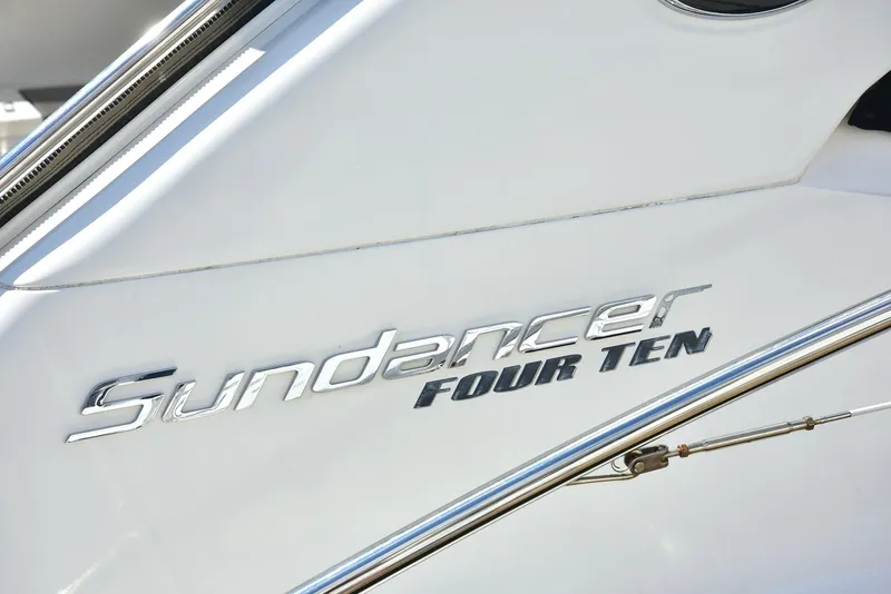Slide: The Image of 2013 Sea Ray 410 Sundancer boat nameplate detail. - 17
