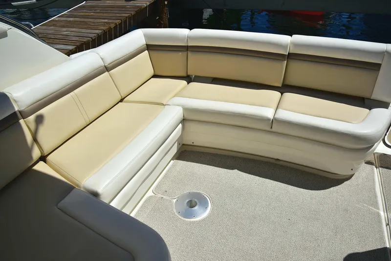 Slide: The Image of Luxurious seating area on 2013 Sea Ray 410 Sundancer yacht, featuring beige upholstery. - 18