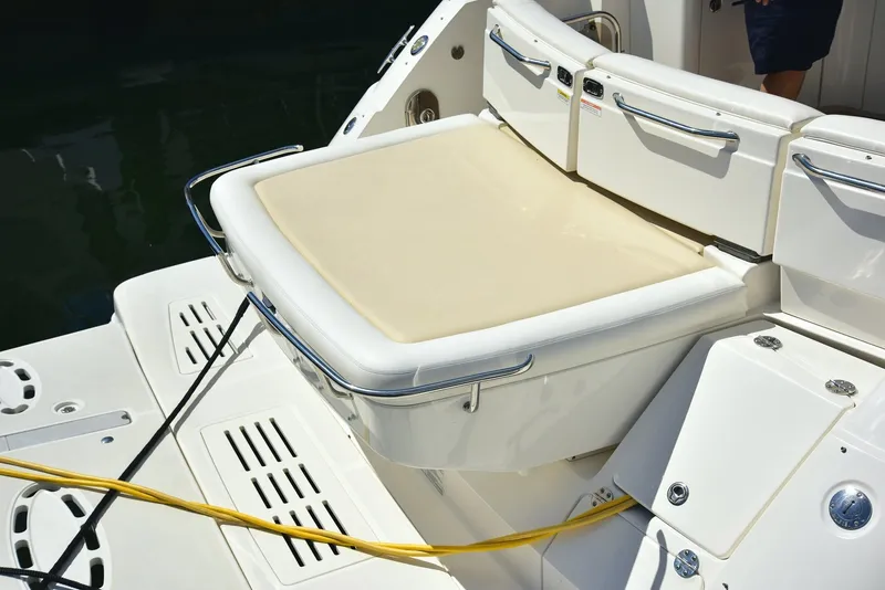 Slide: The Image of 2013 Sea Ray 410 Sundancer boat with cushioned seating and deck details. - 20