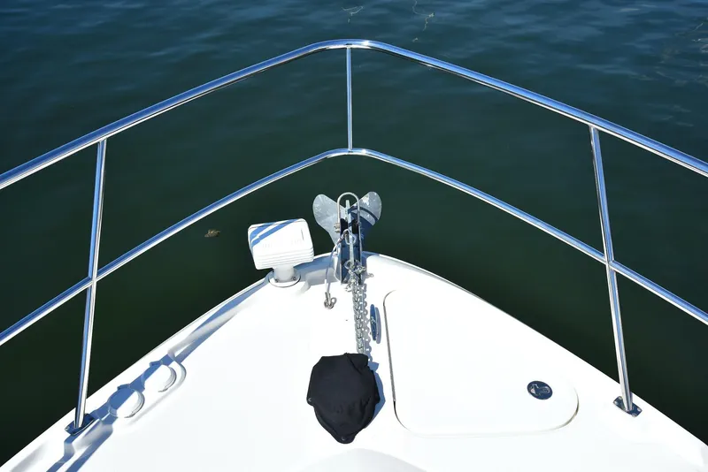 Slide: The Image of Bow view of 2013 Sea Ray 410 Sundancer yacht on calm water. - 26