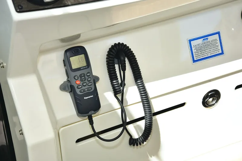 Slide: The Image of VHF radio on 2013 Sea Ray 410 Sundancer boat dashboard. - 47