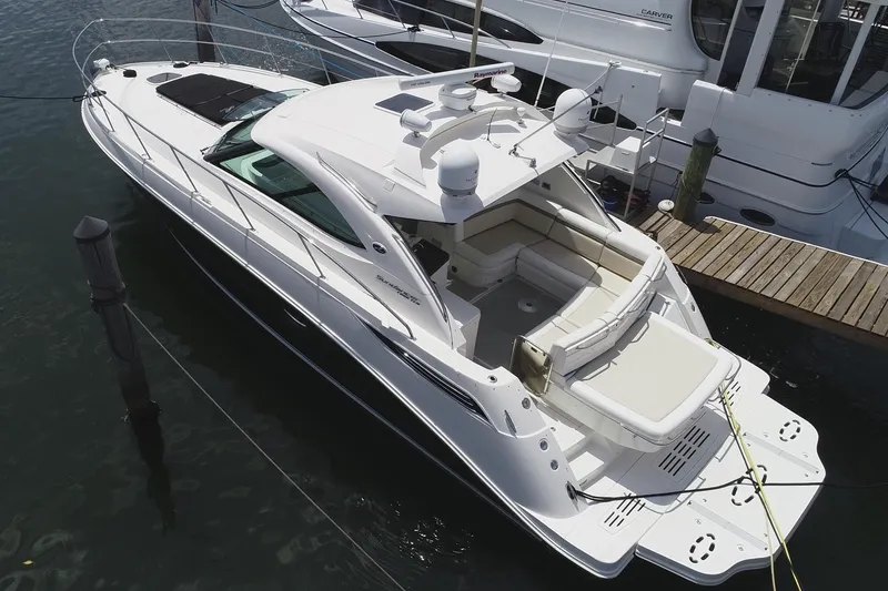 Slide: The Image of 2013 Sea Ray 410 Sundancer yacht docked at marina, aerial view. - 8