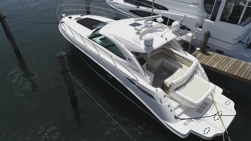 Slide: The Image of 2013 Sea Ray 410 Sundancer yacht docked at marina, aerial view. - 9